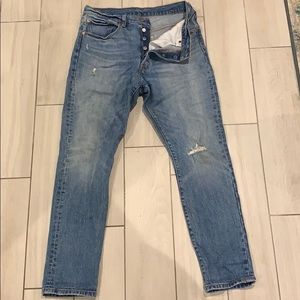 Levi’s 501 button fly distressed skinny blue jeans